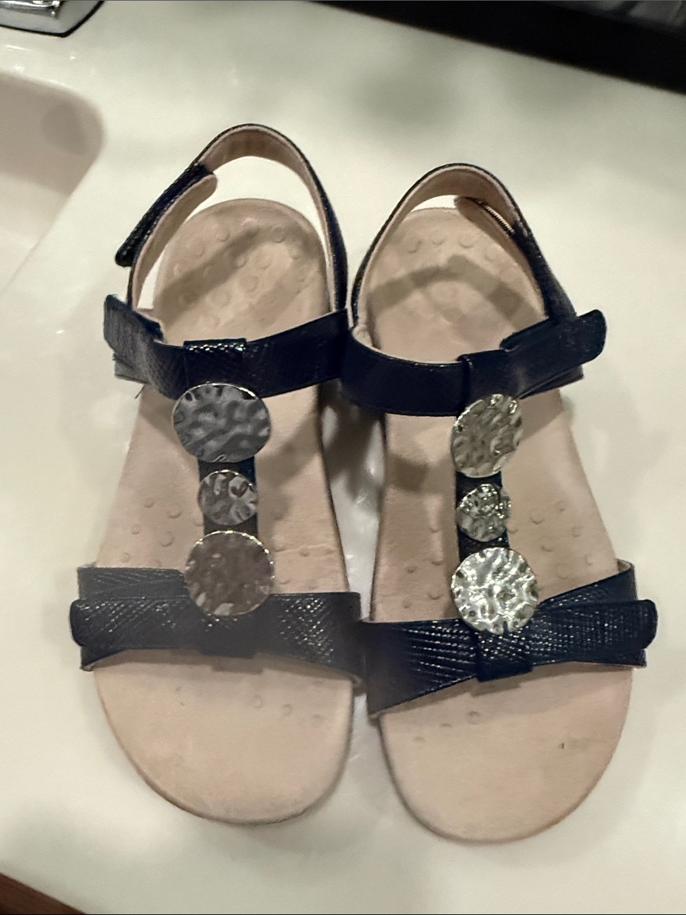 Ionic Women’s Navy T-Strap Sandals with Decorative Medallions